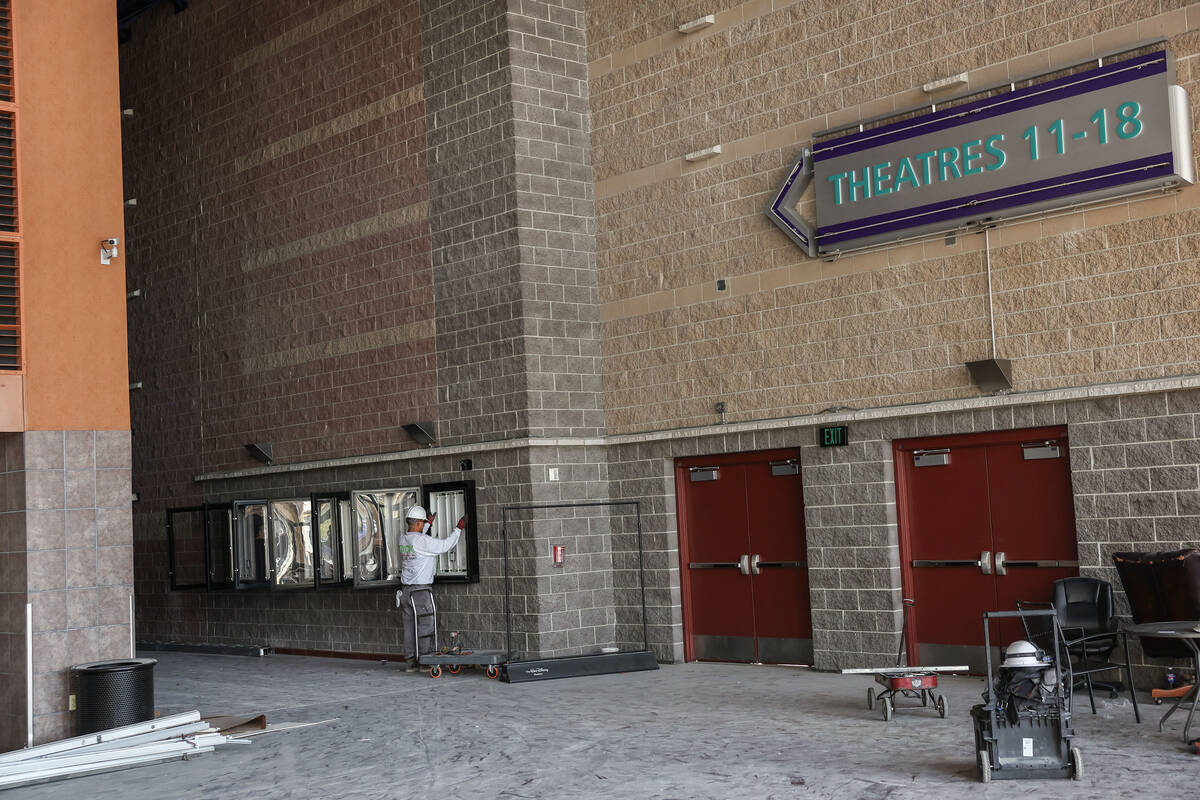 A worker with Yack Construction is seen in the shuttered movie theater in Las Vegas' Village Sq ...