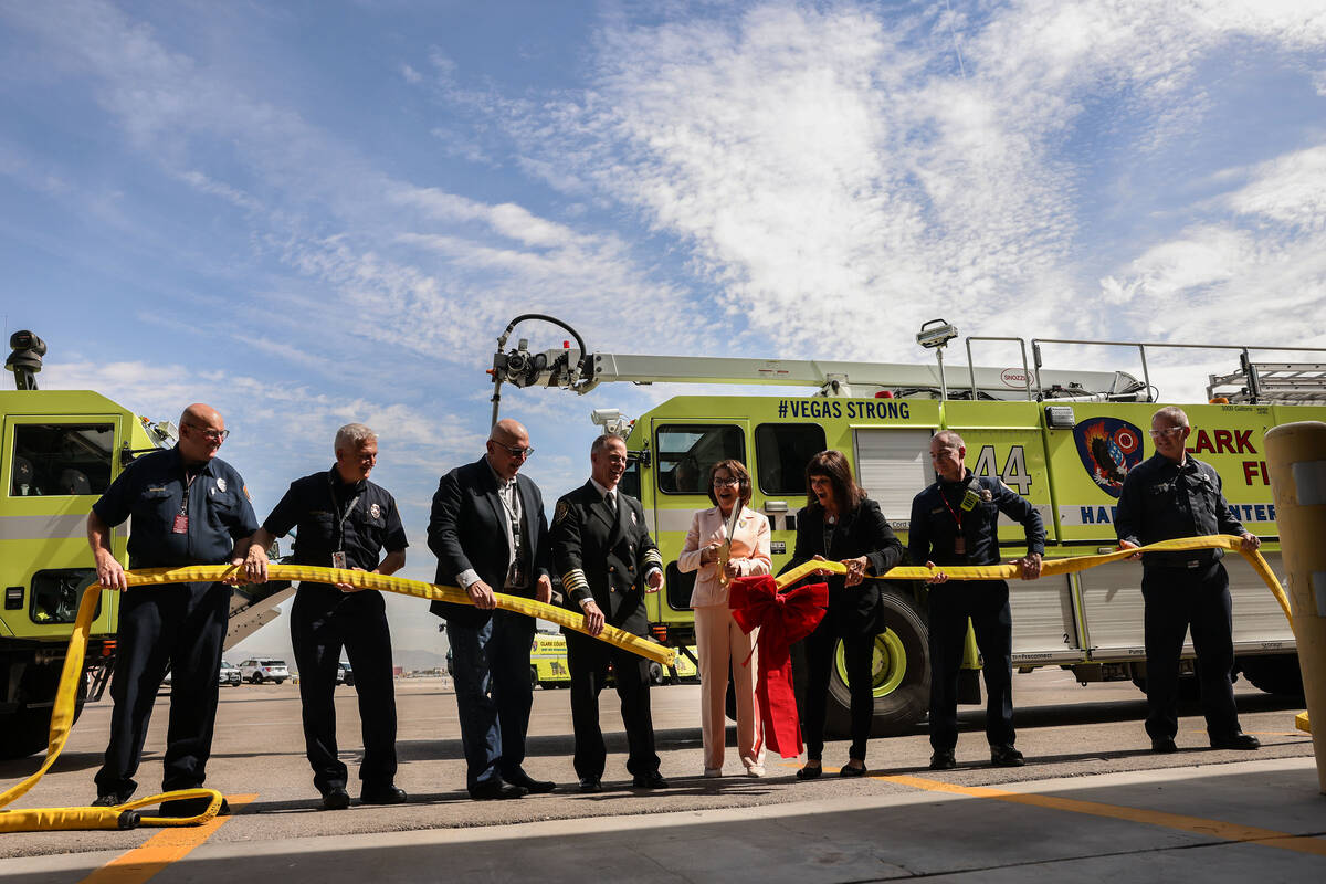 Clark County Fire Chief Billy Samuels, fourth from right, Sen. Jacky Rosen, D-Nev. and Clark Co ...