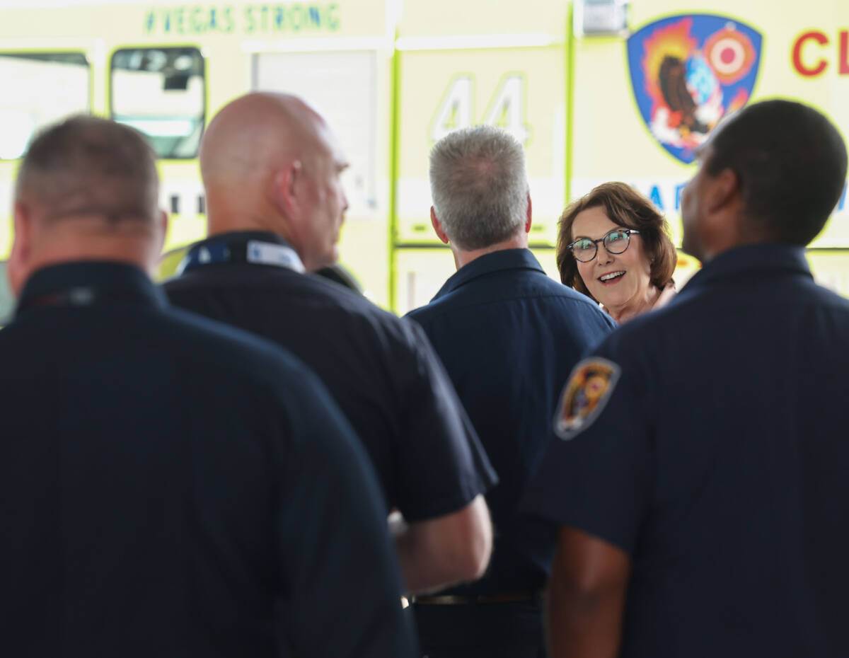 Sen. Jacky Rosen, D-Nev., top/right, speaks to Clark County fire fighters during an unveiling c ...
