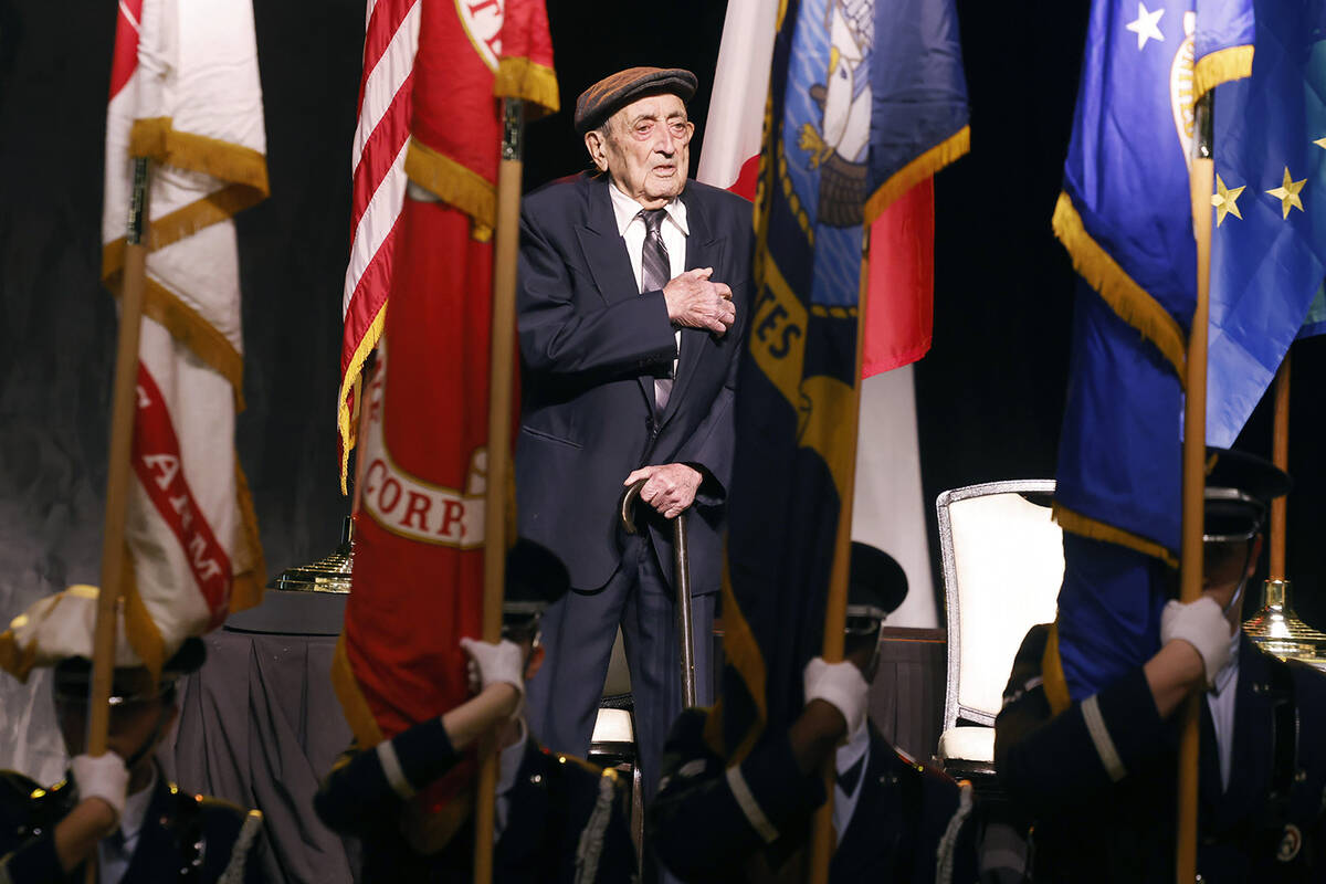 World War II veteran Onofrio "No-No" Zicari places his hand over his heart during the pledge of ...
