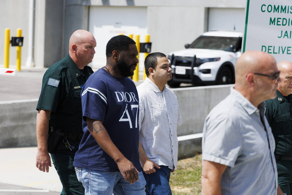 Kilmar Abrego Garcia, third from left, leaves the Putnam County Jail, Friday, Aug. 22, 2025, in ...