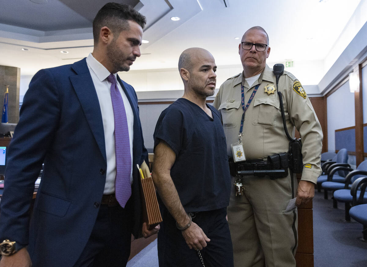 Robert Telles, center, leaves the courtroom on Sept. 20, 2022, in Las Vegas. (Bizuayehu Tesfaye ...