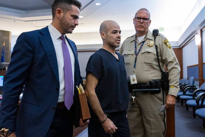 Robert Telles, center, leaves the courtroom on Sept. 20, 2022, in Las Vegas. (Bizuayehu Tesfaye ...