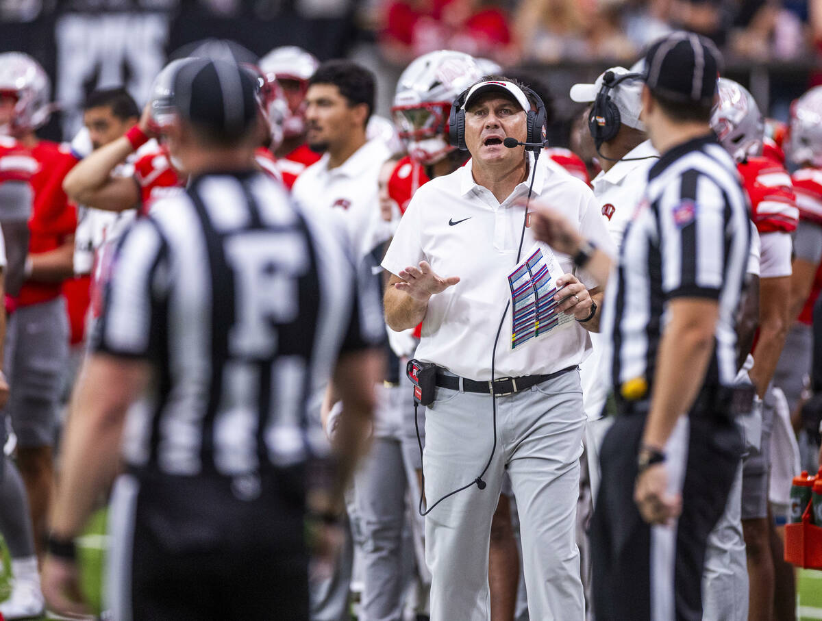 UNLV head coach Dan Mullen talks to the refs on the sidelines against the Idaho State Bengals d ...