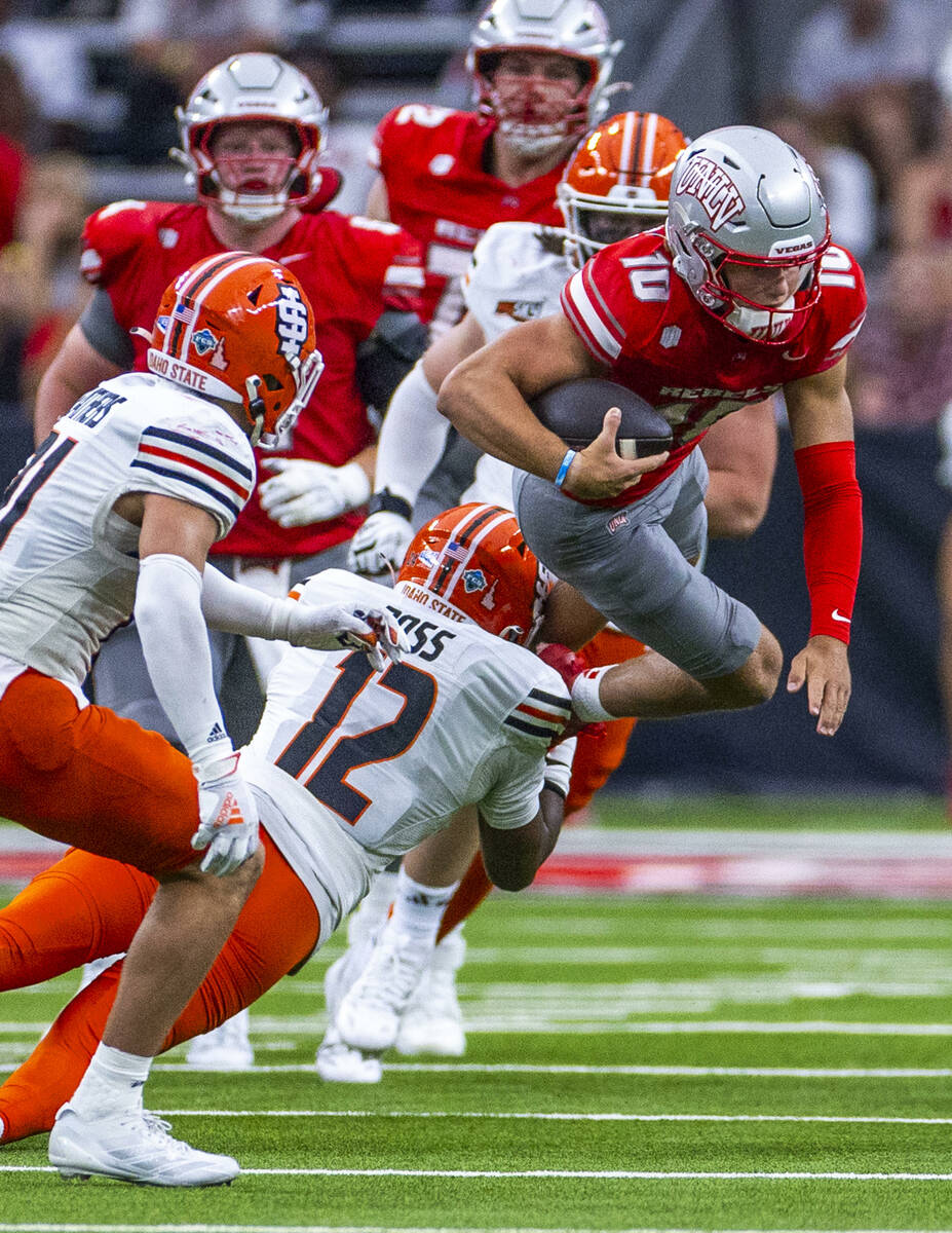 UNLV quarterback Anthony Colandrea (10) is stopped after a run by Idaho State Bengals defensive ...