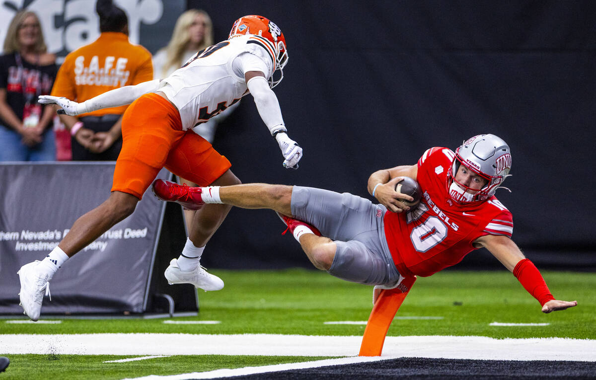 UNLV quarterback Anthony Colandrea (10) dives into the end zone with Idaho State Bengals corner ...