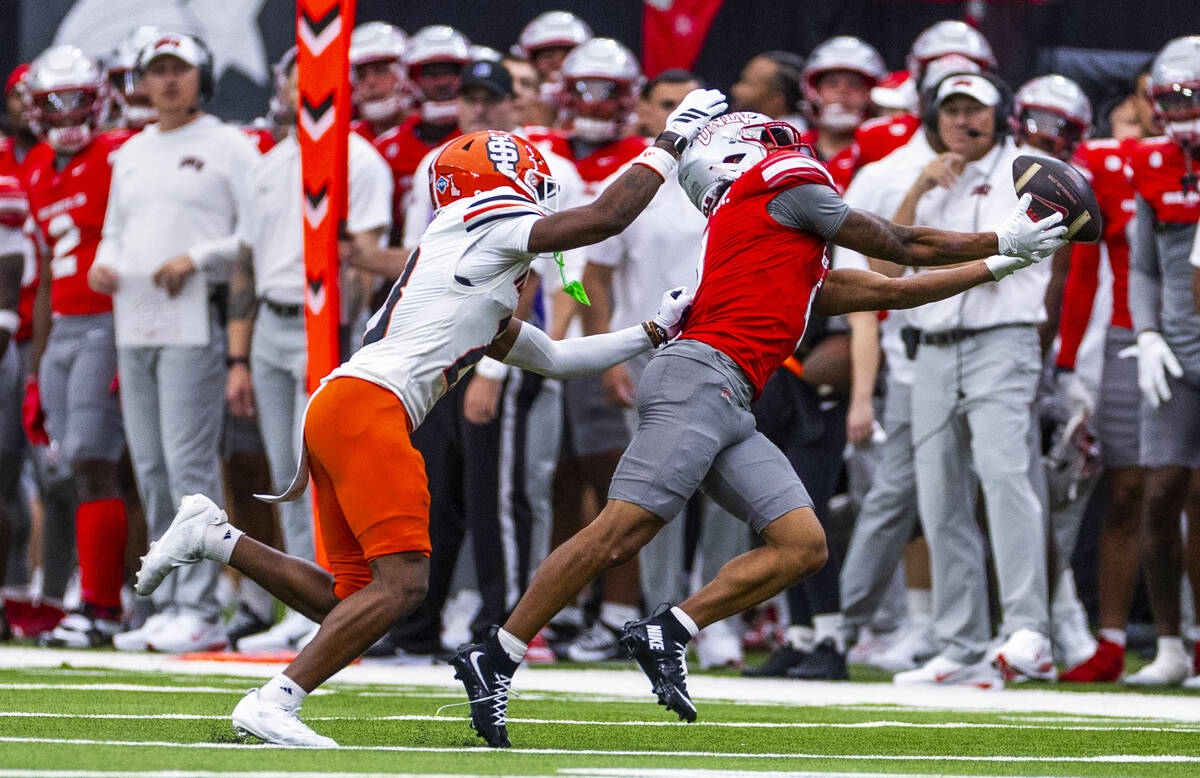 UNLV wide receiver DeAngelo Irvin Jr. (4) extends for a catch attempt over Idaho State Bengals ...