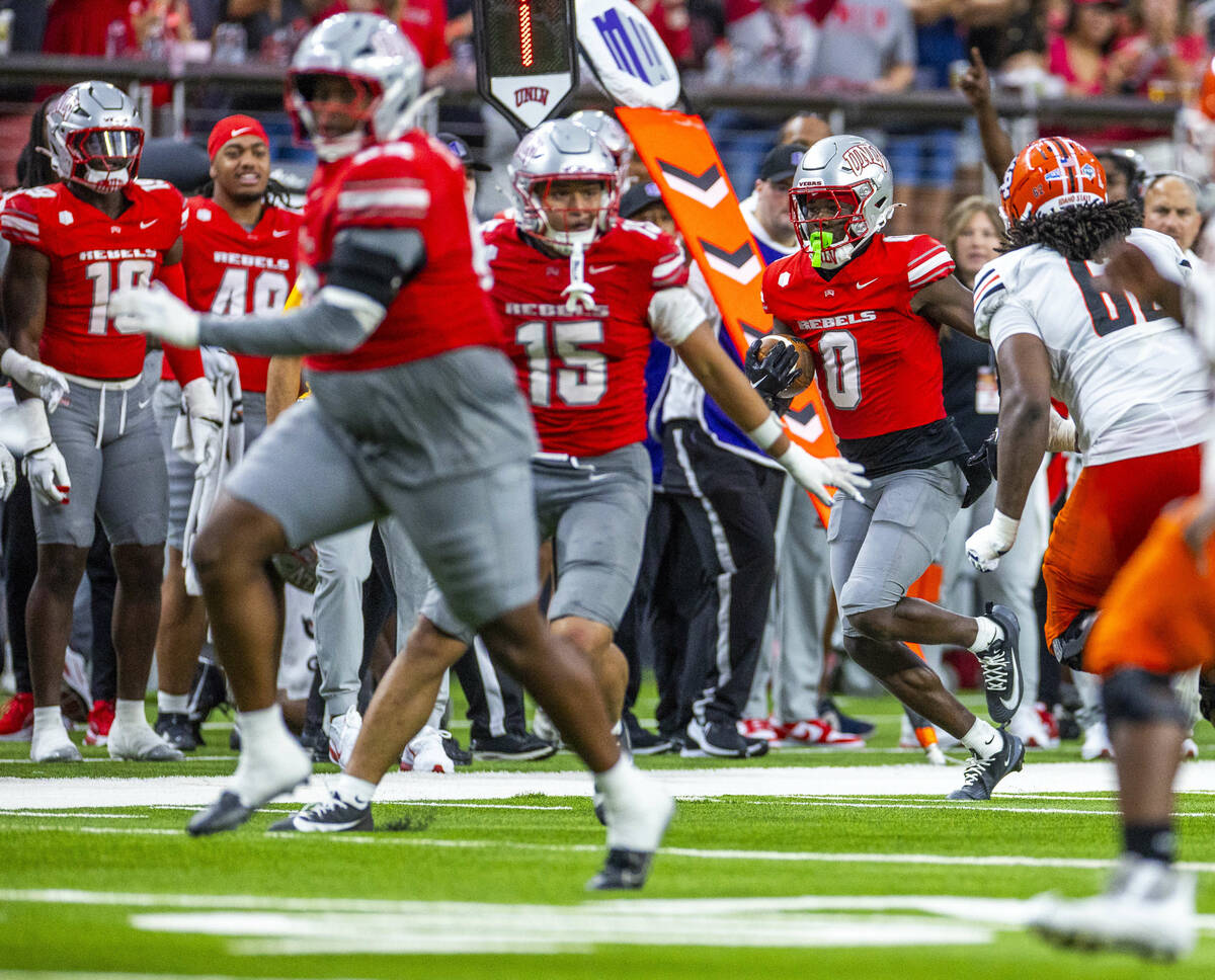 UNLV wide receiver Troy Omeire (0) runs back an interception against the Idaho State Bengals du ...