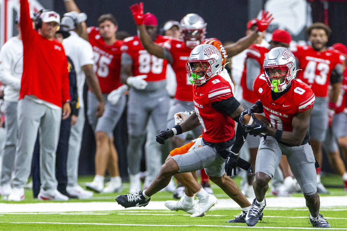 UNLV defensive back Laterrance Welch (0) intercepts a pass against the Idaho State Bengals duri ...