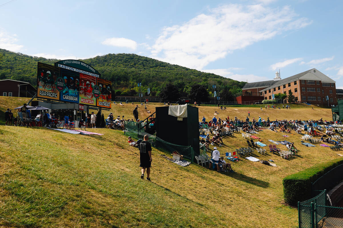 People roam the grass at Little League International Saturday, Aug. 23, 2025, in Williamsport, ...