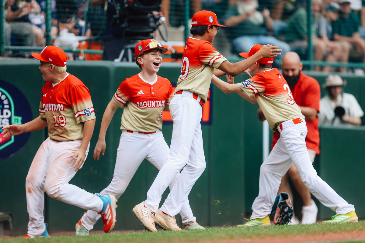 Summerlin South teammates celebrate after winning a Little League World Series semifinals game ...