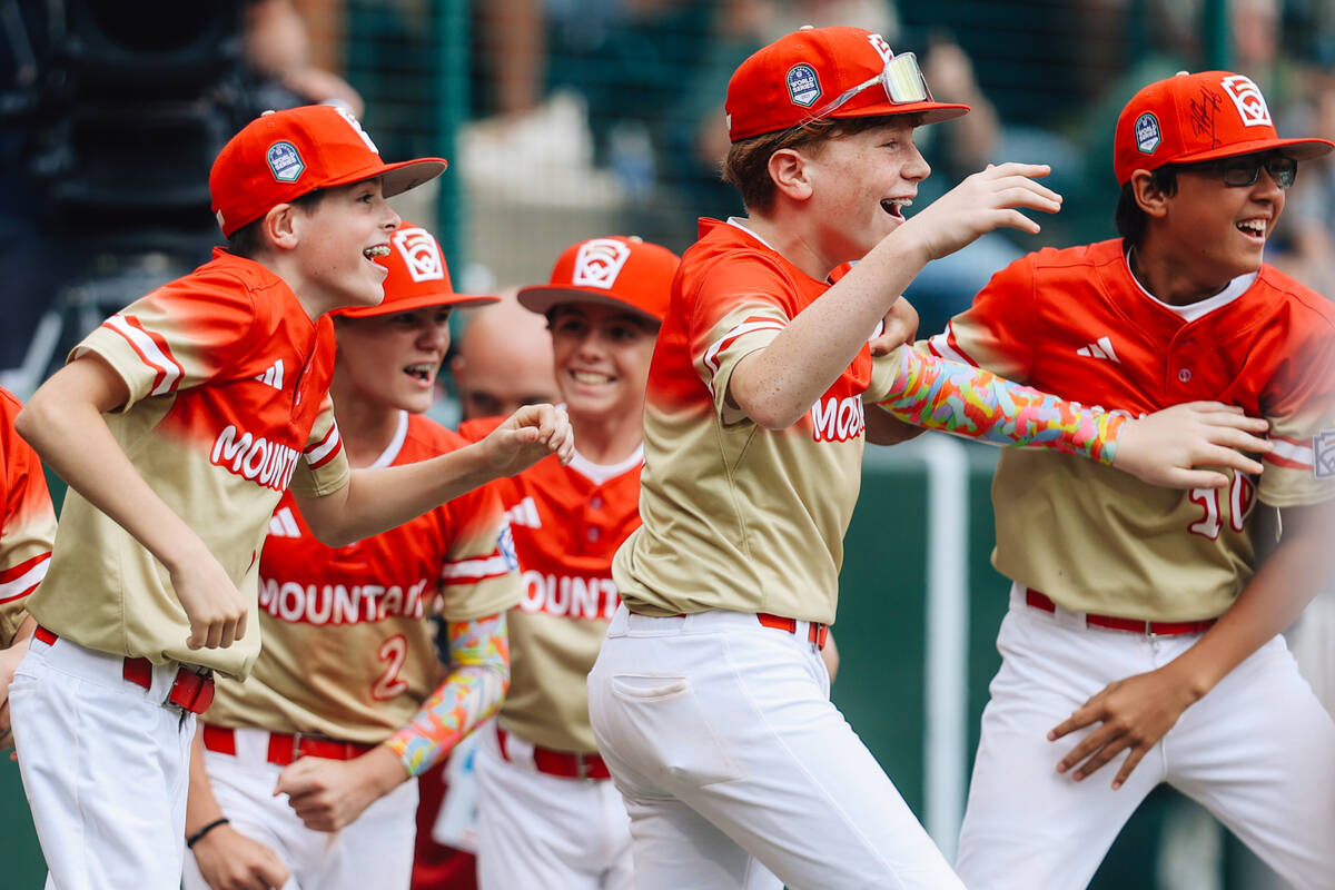 Summerlin South teammates celebrate after winning a Little League World Series semifinals game ...