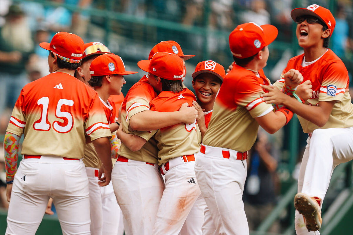 Summerlin South teammates celebrate after winning a Little League World Series semifinals game ...