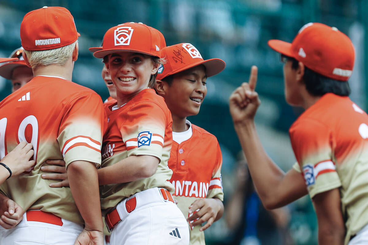 Summerlin South teammates celebrate after winning a Little League World Series semifinals game ...