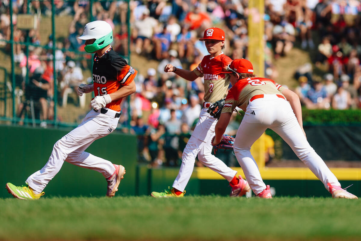 Fairfield National pitcher Tommy D'Amura (15) is tagged out by Summerlin South third baseman Ba ...