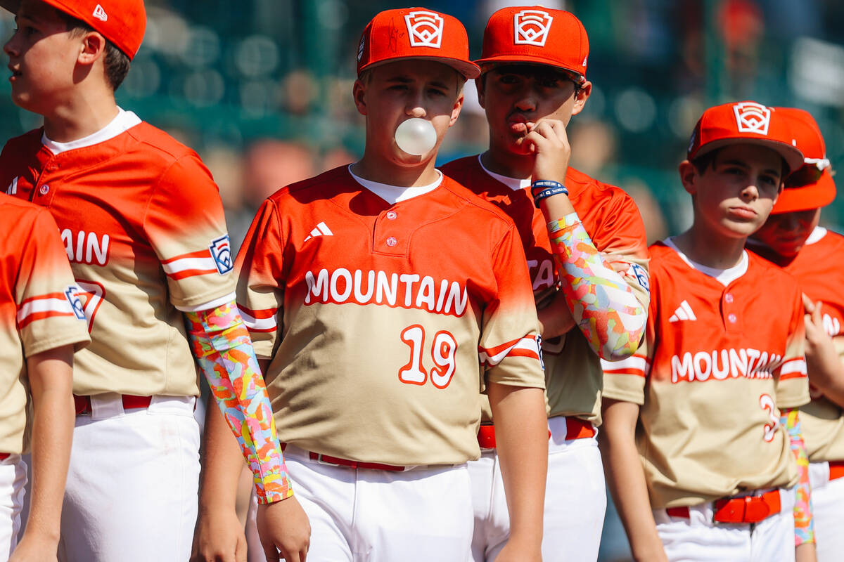 Summerlin South pitcher Garrett Gallegos blows a bubble with bubble gum during a Little League ...