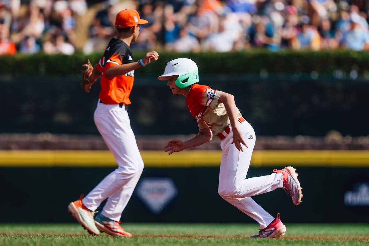 Summerlin South center fielder Brooks Fechser (12) makes a run for third base during a Little L ...