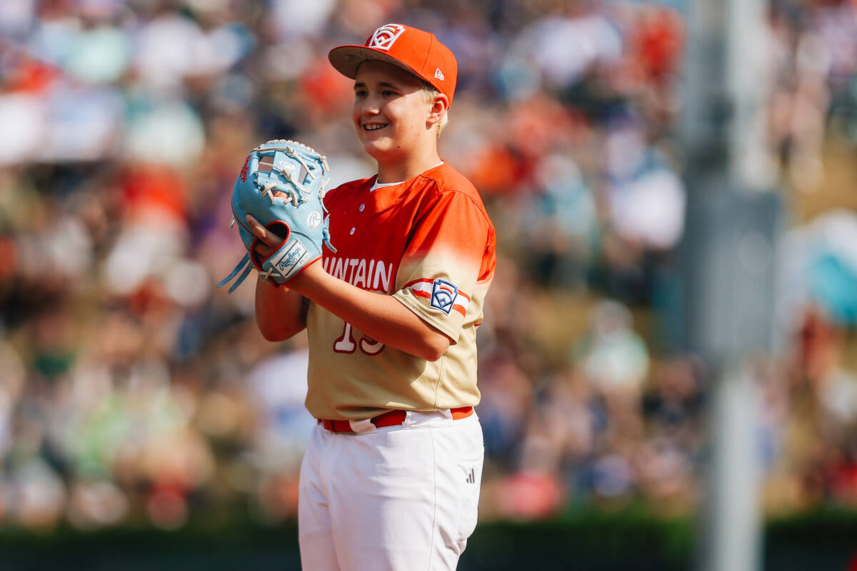 Summerlin South pitcher Garrett Gallegos smiles before pitching the ball during a Little League ...