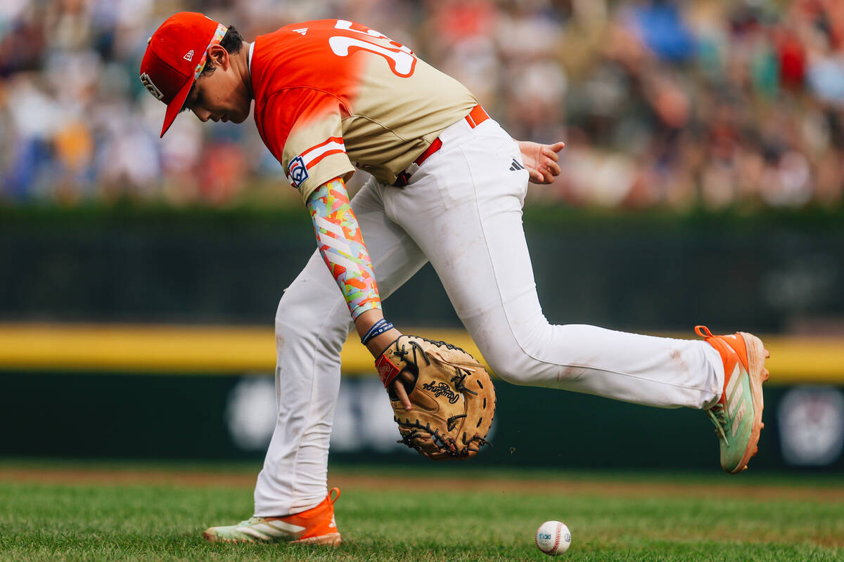 Summerlin South first baseman Grayson Miranda reaches for the ball during a Little League World ...