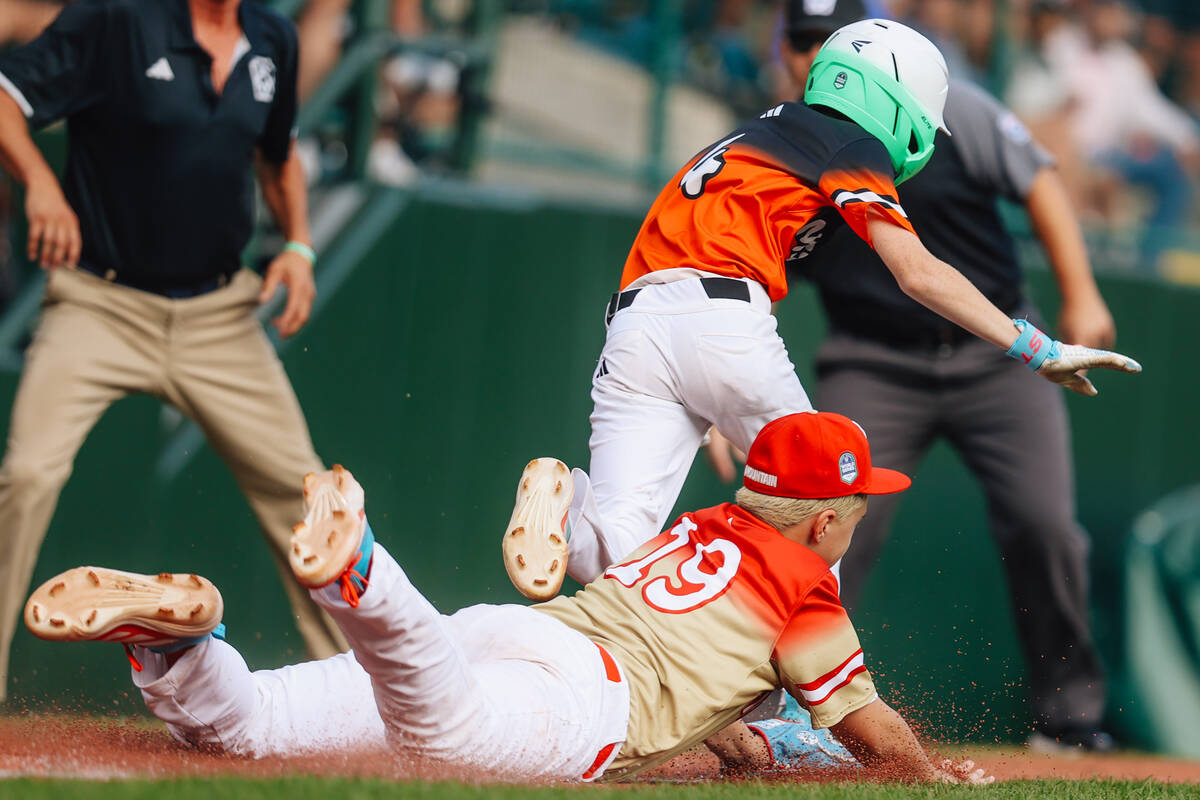 Summerlin South pitcher Garrett Gallegos (19) tags Fairfield National right fielder Ben Herbst ...