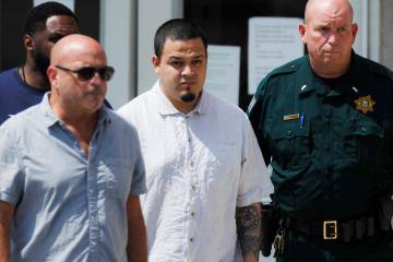 Kilmar Abrego Garcia, center, leaves the Putnam County Jail, Friday, Aug. 22, 2025, in Cookevil ...
