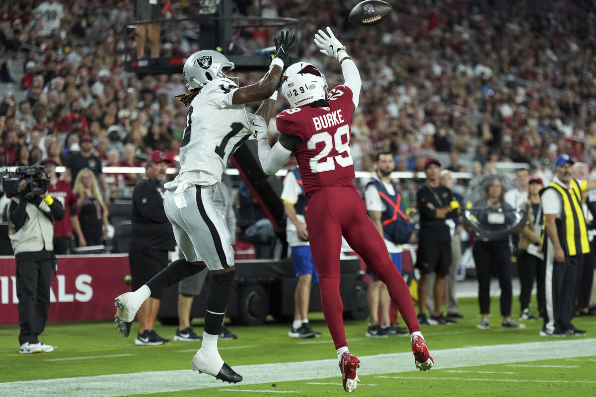 Las Vegas Raiders wide receiver Dont'e Thornton Jr. pulls in a touchdown pass as Arizona Cardin ...