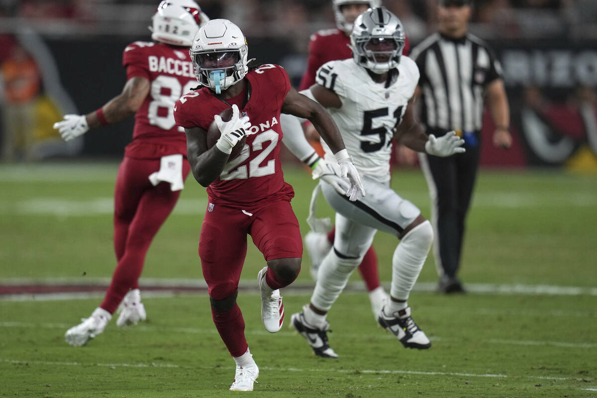 Arizona Cardinals running back Michael Carter (22) runs the ball against the Las Vegas Raiders ...