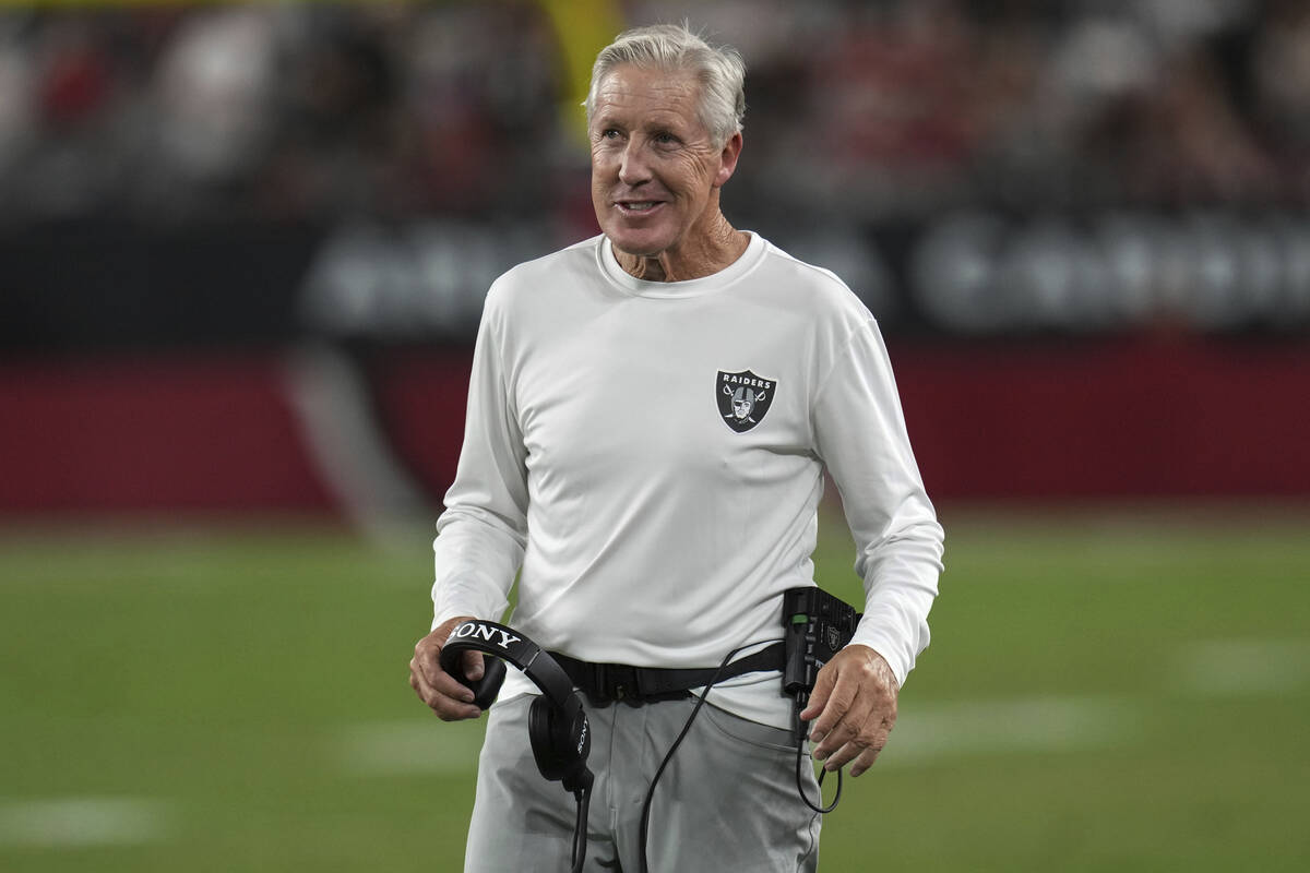Las Vegas Raiders head coach Pete Carroll smiles during the first half of an NFL preseason foot ...