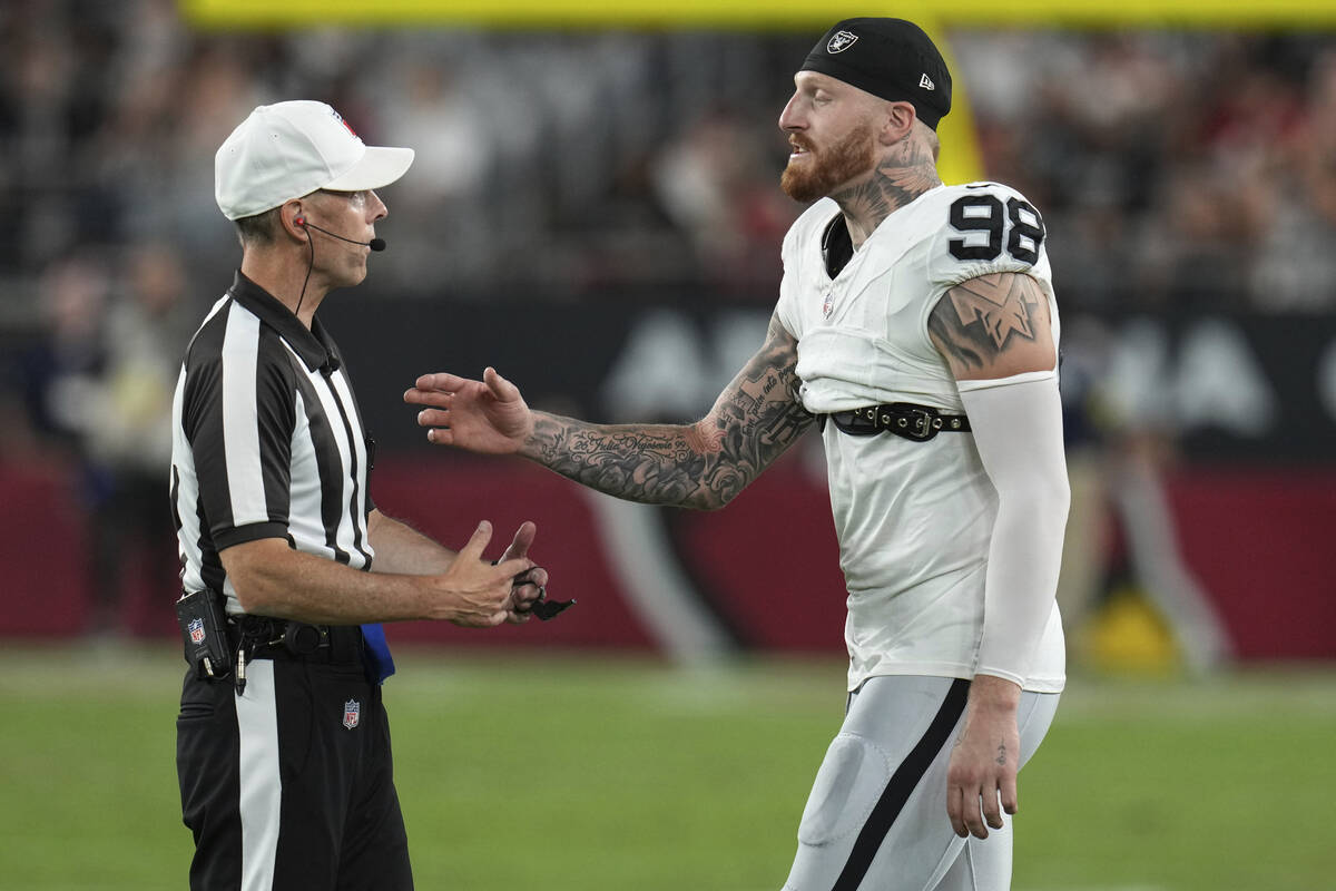 Las Vegas Raiders defensive end Maxx Crosby (98) talks to the ref during the first half of an N ...