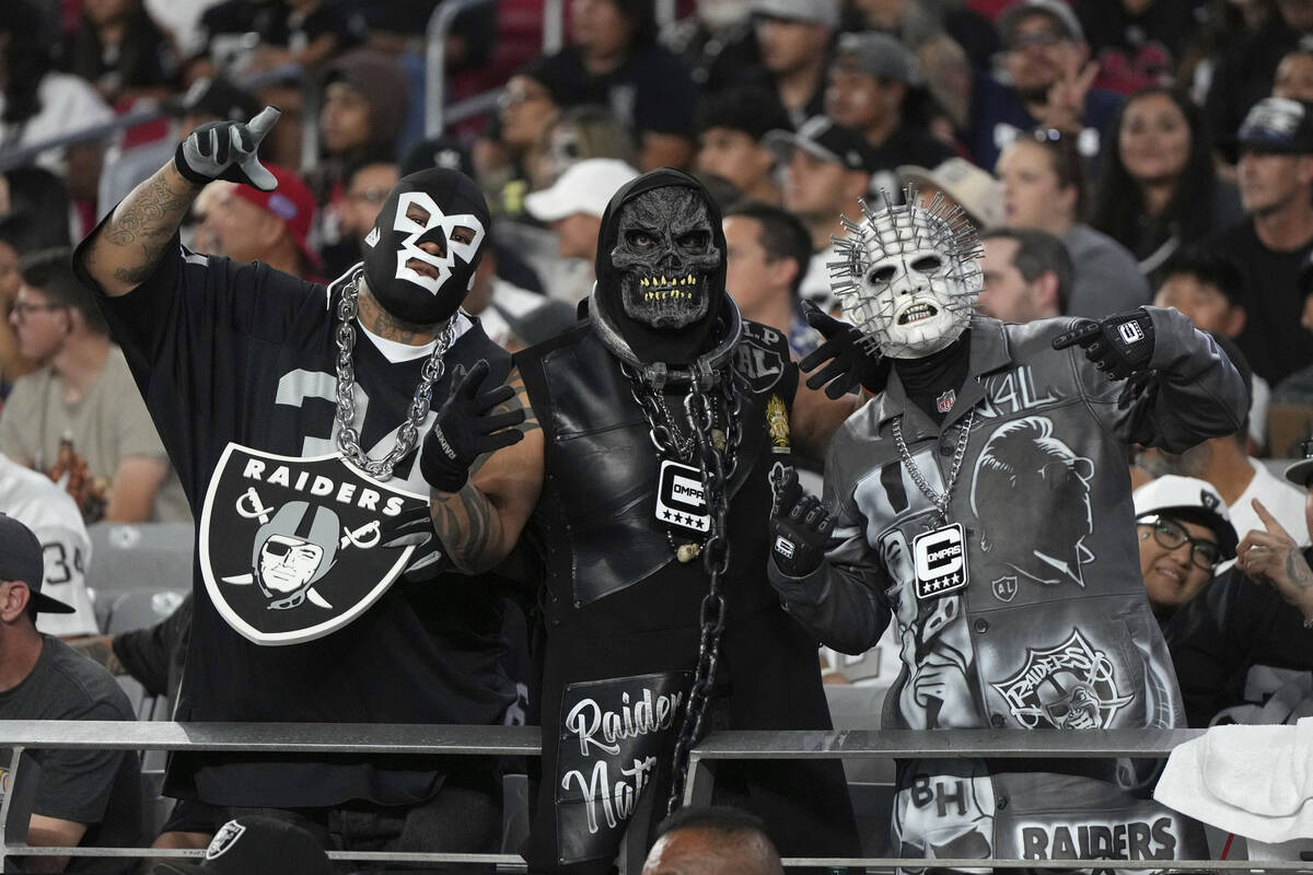 Las Vegas Raiders fans watch during the first half of an NFL preseason football game against th ...