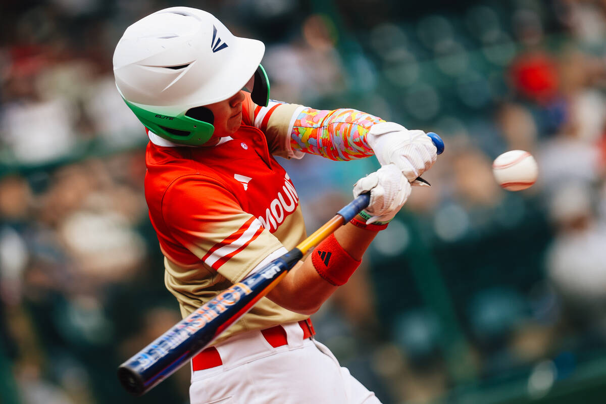 The ball speeds towards Summerlin South pitcher Cache Malan’s bat during a Little League ...
