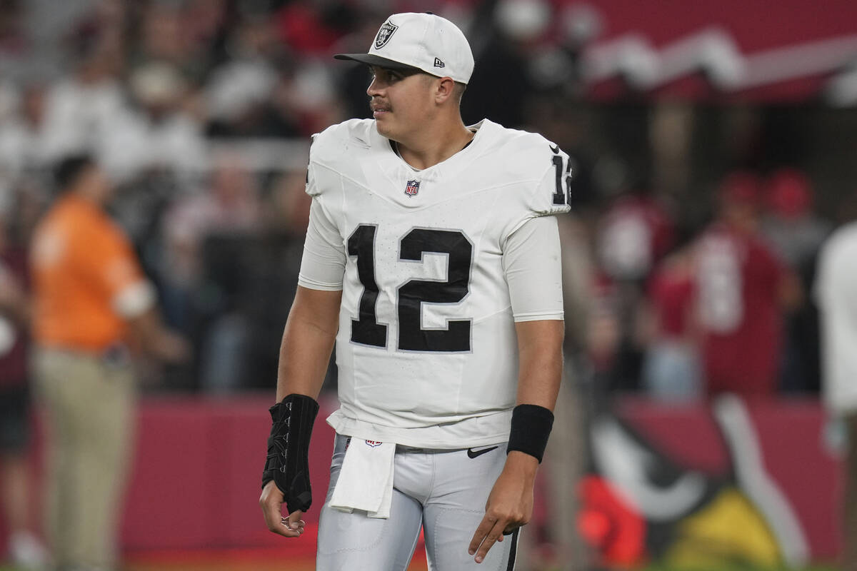 Las Vegas Raiders quarterback Aidan O'Connell watches during a timeout during the second half o ...