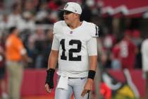 Las Vegas Raiders quarterback Aidan O'Connell watches during a timeout during the second half o ...