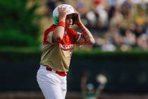 Summerlin South third baseman Garrett Gallegos reacts after being called out while running to s ...