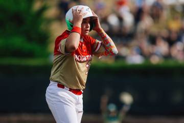 Summerlin South third baseman Garrett Gallegos reacts after being called out while running to s ...
