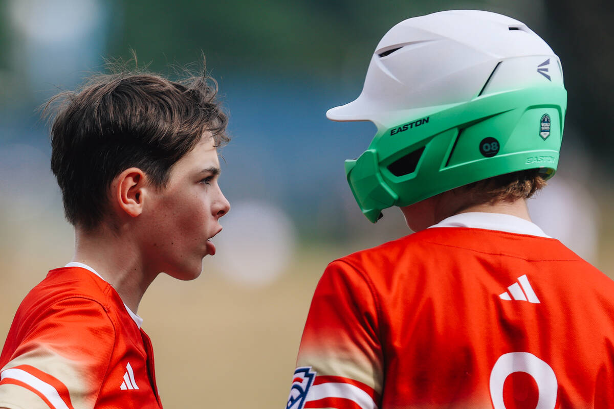 Summerlin South second baseman Luke D'Ambrosio, left, speaks to a teammate as a play is inner r ...
