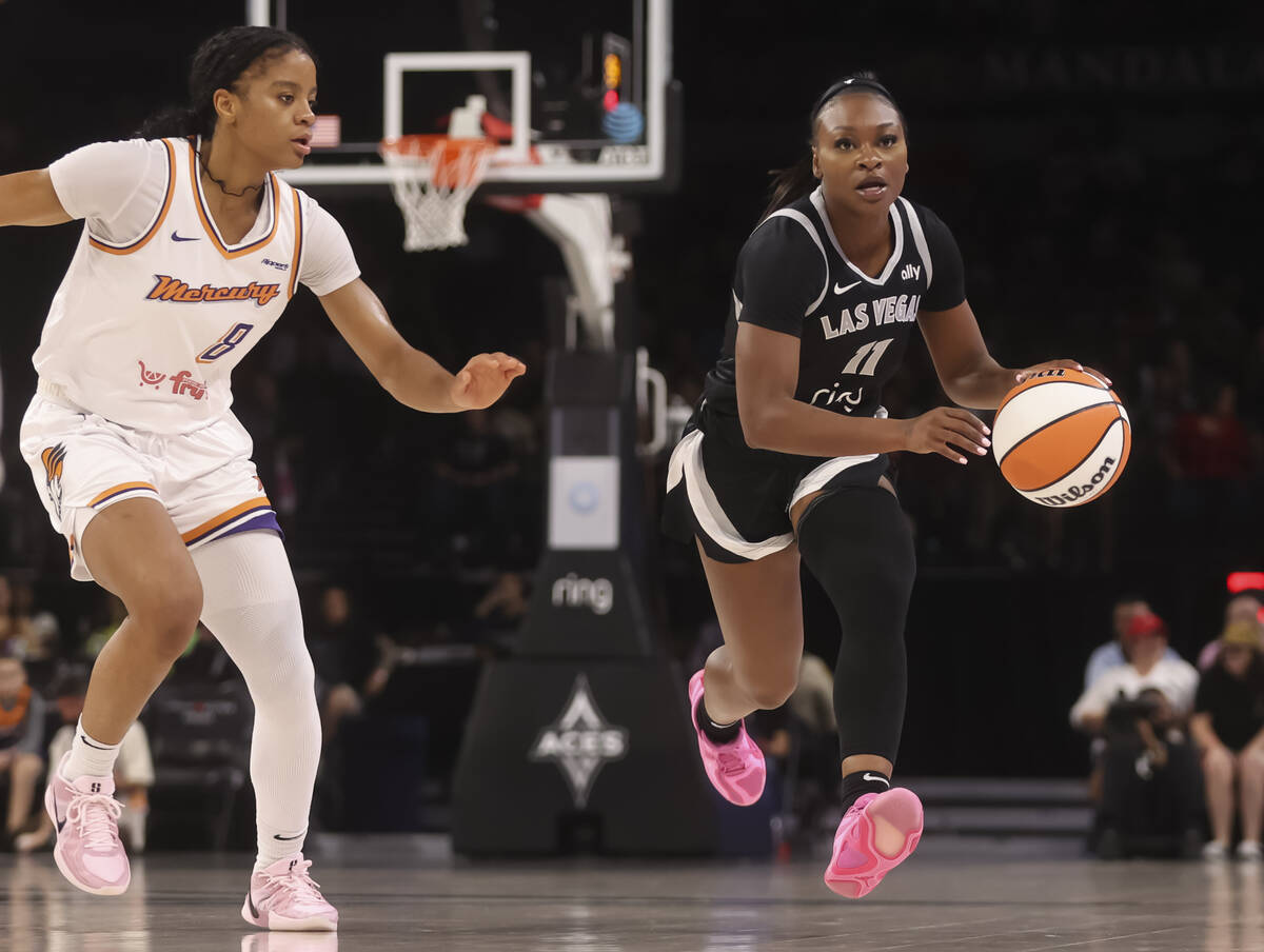 Aces guard Dana Evans (11) brings the ball up court against the Phoenix Mercury during the firs ...