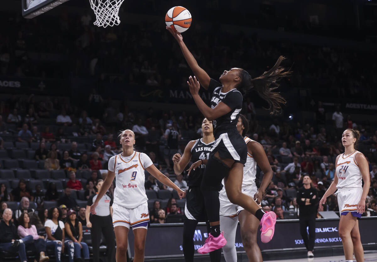 Aces guard Dana Evans (11) lays put the ball against the Phoenix Mercury during the second half ...