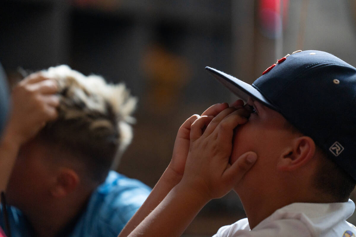 Local Little League players react to a play while watching Summerlin South take on Taipei in th ...