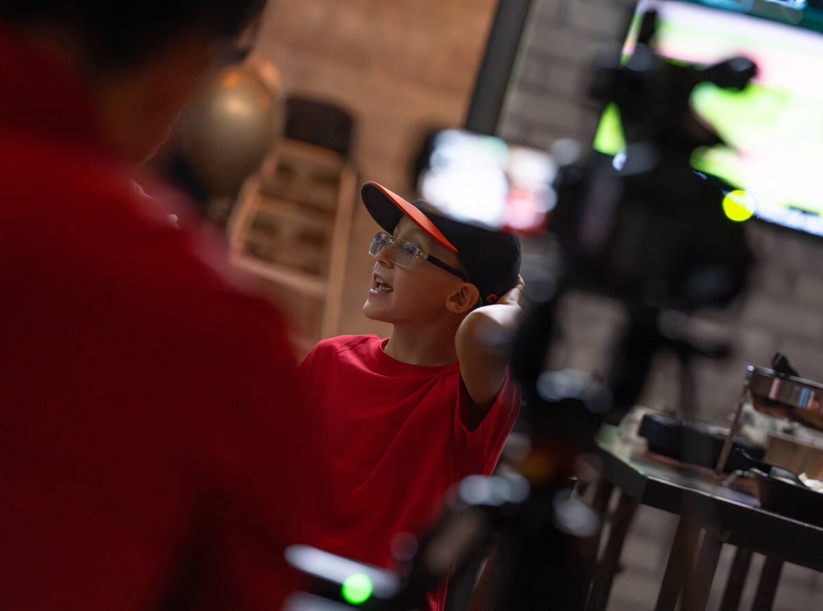 Media interview local Little League players and families during a watch party at Nacho Daddy in ...