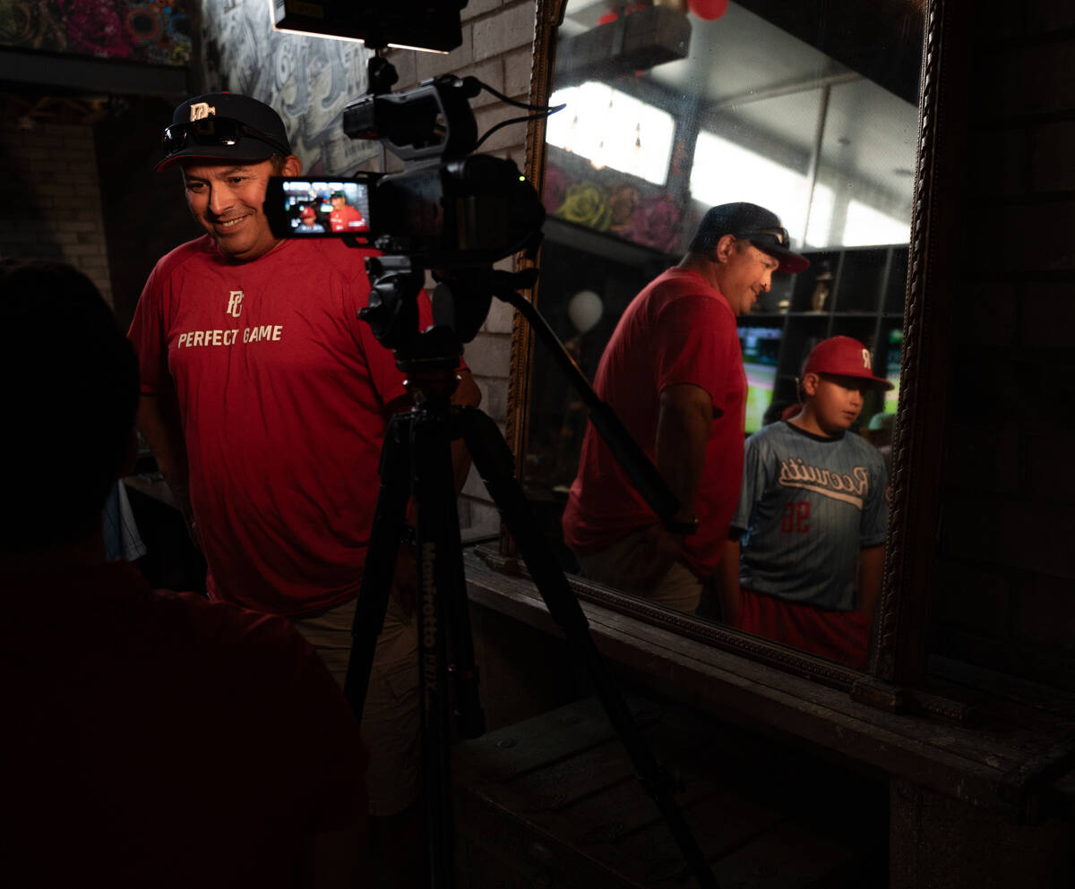 Media interview local Little League players and families during a watch party at Nacho Daddy in ...