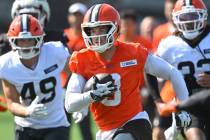 Cleveland Browns quarterback Kenny Pickett (8) runs with the ball during a practice at the team ...