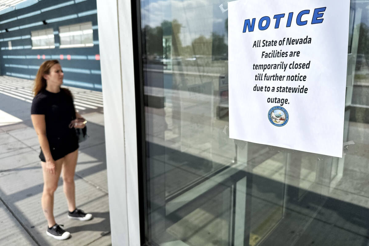 A woman arrives at the DMV office on east Sahara Avenue to find it closed Tuesday, Aug. 26, 202 ...