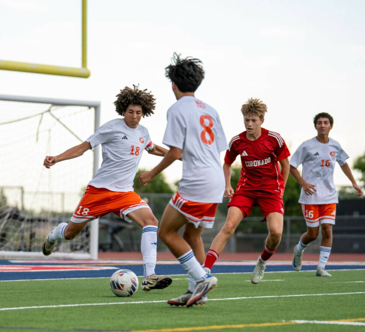 Bishop Gorman defender Eli Harris (18) boots the ball away from the goal during a soccer match ...