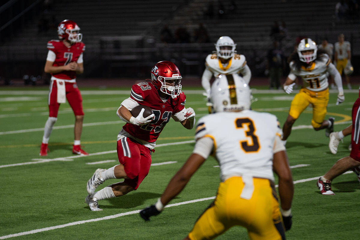 Aggie Noah Easton (23) moves the ball during a football game between Mililani and Arbor View at ...