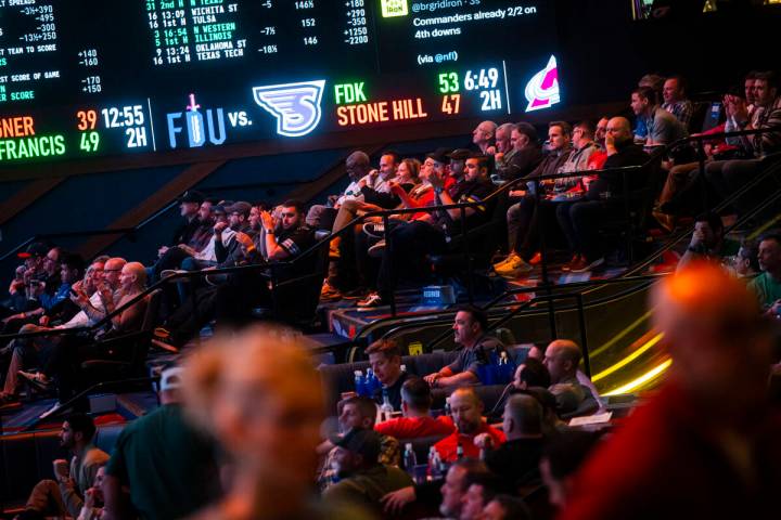 People watch the NFC championship football game between the Philadelphia Eagles and Washington ...
