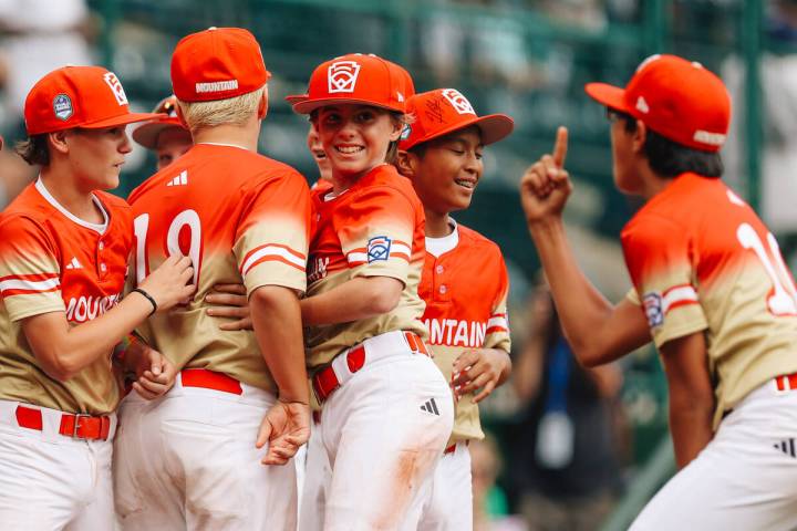 Summerlin South teammates celebrate after winning a Little League World Series semifinals game ...