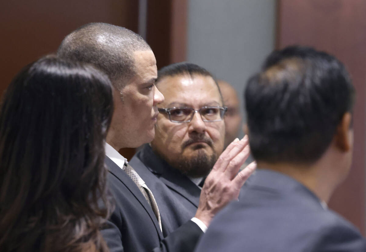Roidan Durruthy Mendoza, center, who is accused of killing his estranged wife and injuring thre ...