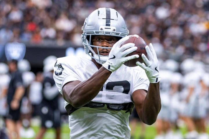Raiders wide receiver Phillip Dorsett II (13) secures a catch during the first half of a Raider ...