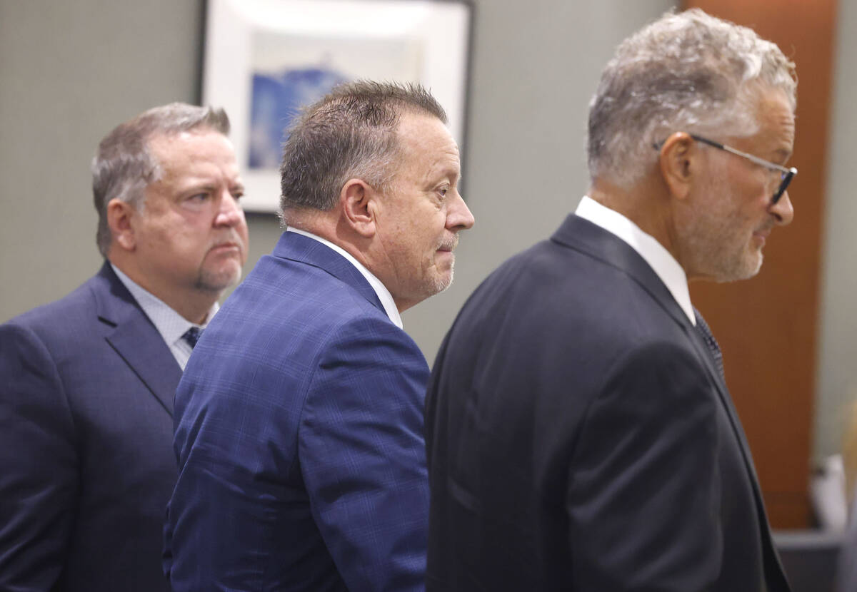 Former defense attorney Gary Guymon, center, accused of sex trafficking and plotting with felon ...